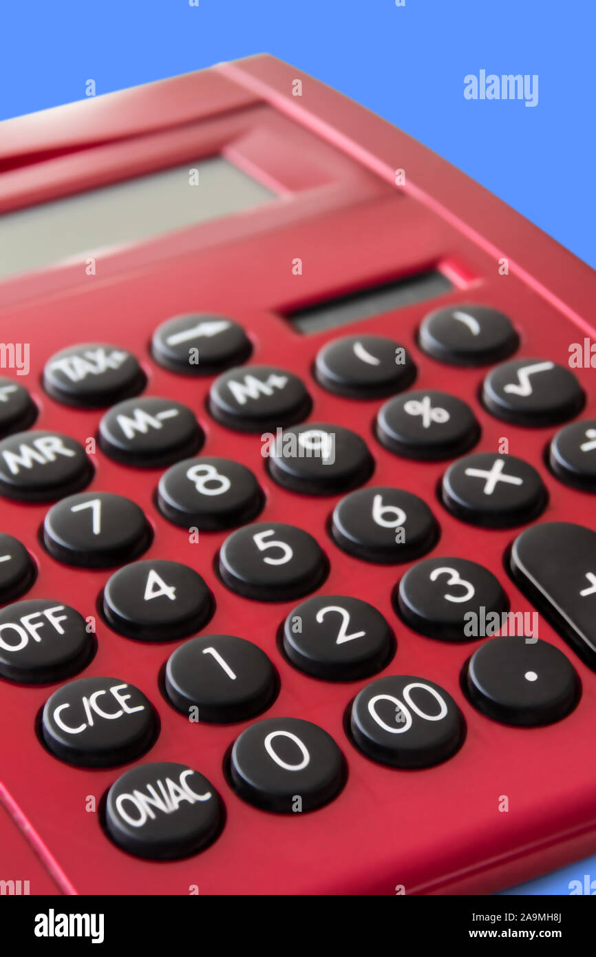 Red pocket calculator in close-up background Stock Photo - Alamy