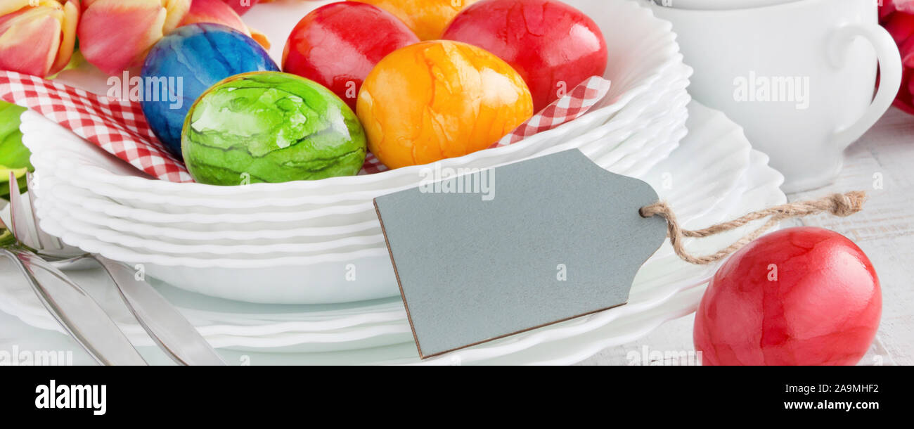 Easter Decoration Breakfast Table with red Easter Eggs and label as Background Stock Photo