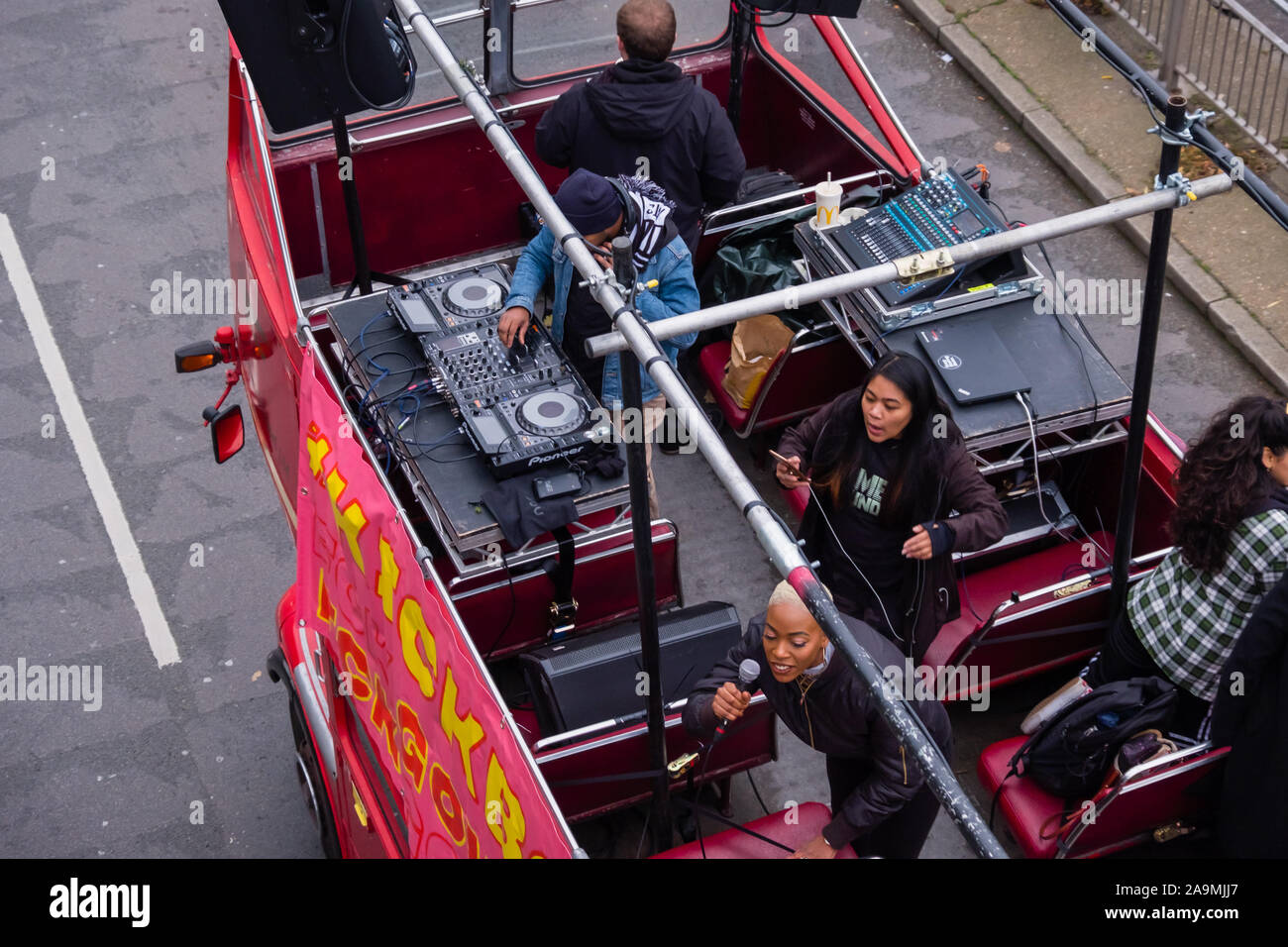 London, UK. 16th November 2019. he sound system on the bus as protesters from FCKBoris in orange knitted hats walk through Uxbridge  urging everyone to register and vote against Boris Johnson and kick him out for his racist, elitist politics. They marched to Brunel University to persuade students. Johnson had a majority of just over 5 thousand in 2017 and Labour candidate Ali Milani has strong hopes of beating him and the other 10 candidates. Peter Marshall/Alamy Live News Stock Photo