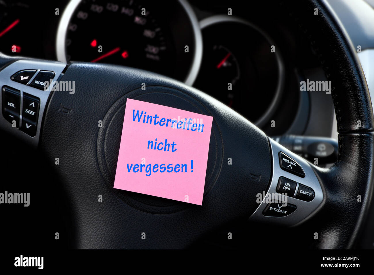 German winter tires reminder car dashboard background with label Stock