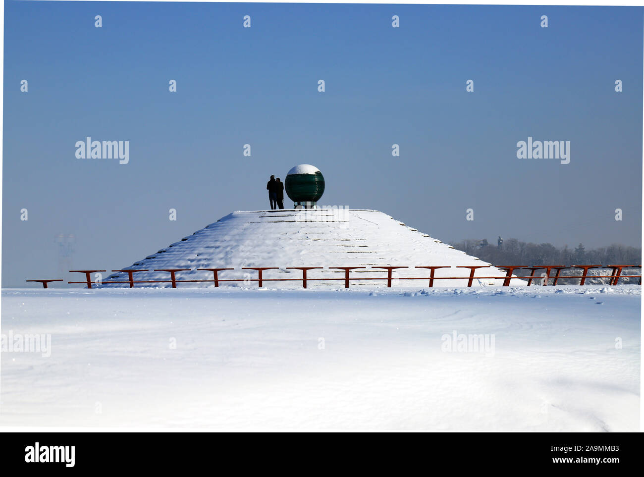 Snowy winter landscape, streets and a pyramid covered in snow. Cityscape in the Dnipro city, Dnepropetrovsk, Ukraine, December, January, February Stock Photo