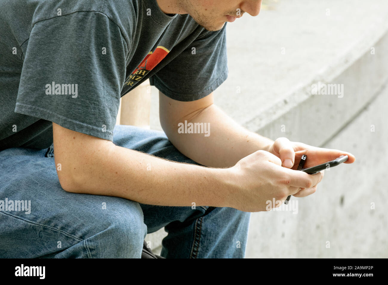 WA17343-00...WASHINGTON - Man with cell phone in Seattle. No MR Stock Photo