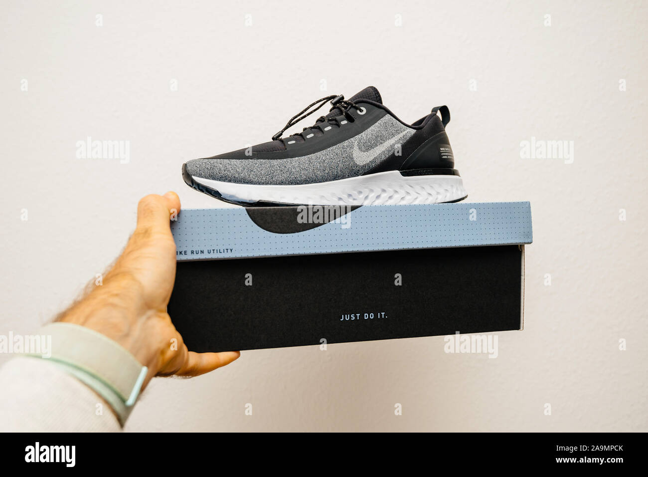 Holding nike shoe hi-res stock photography and images - Alamy