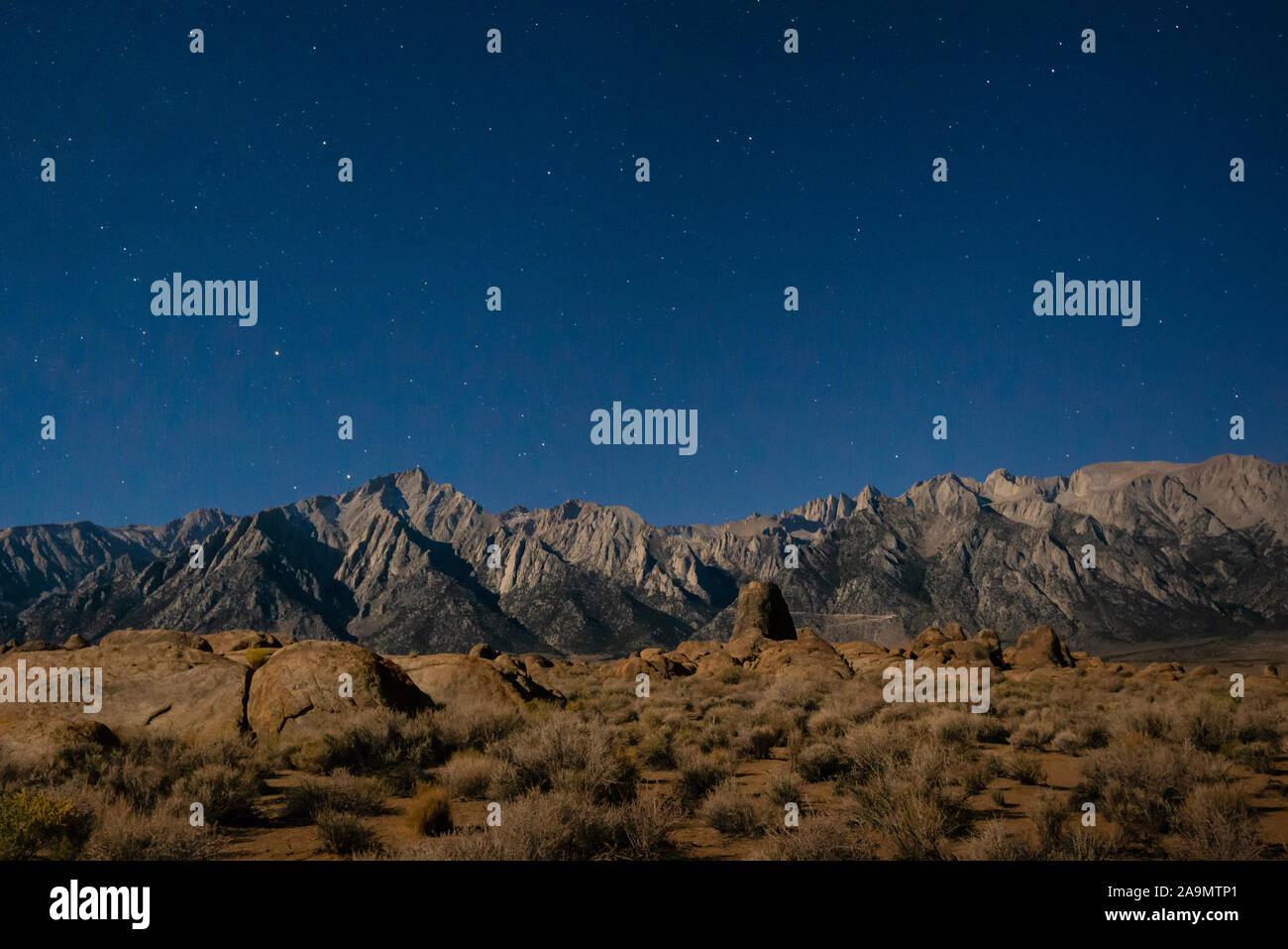 Stars over Lone Pine Peak and Whitney Portals from Alabama Hills Recreation Area, eastern Sierra Nevada Mountains, California. Stock Photo