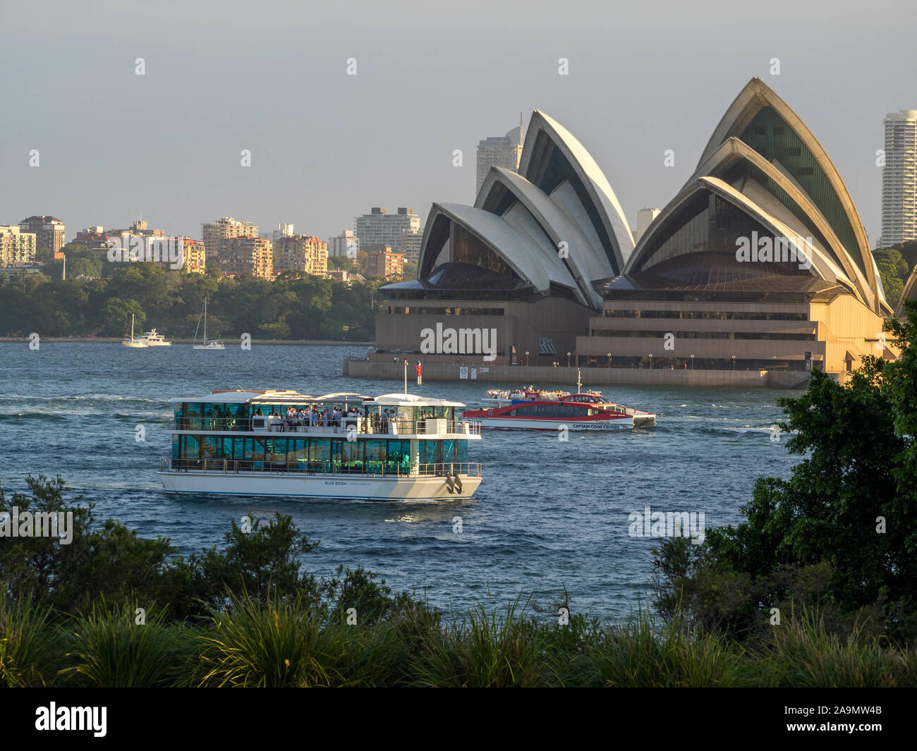 Touristical ferry boat passing by Sydney Opera House Stock Photo