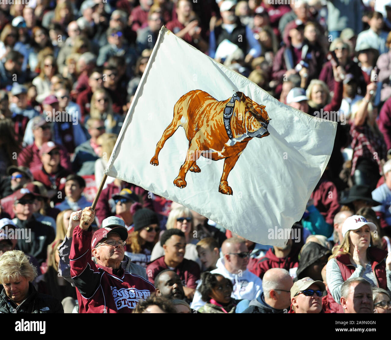 Starkville, MS, USA. 16th Nov, 2019. Mississippi State fans fly a bulldog flag during the NCAA football game between the Alabama Crimson Tide and the Mississippi State Bulldogs at Davis Wade Stadium in Starkville, MS. Credit: Kevin Langley/CSM/Alamy Live News Stock Photo