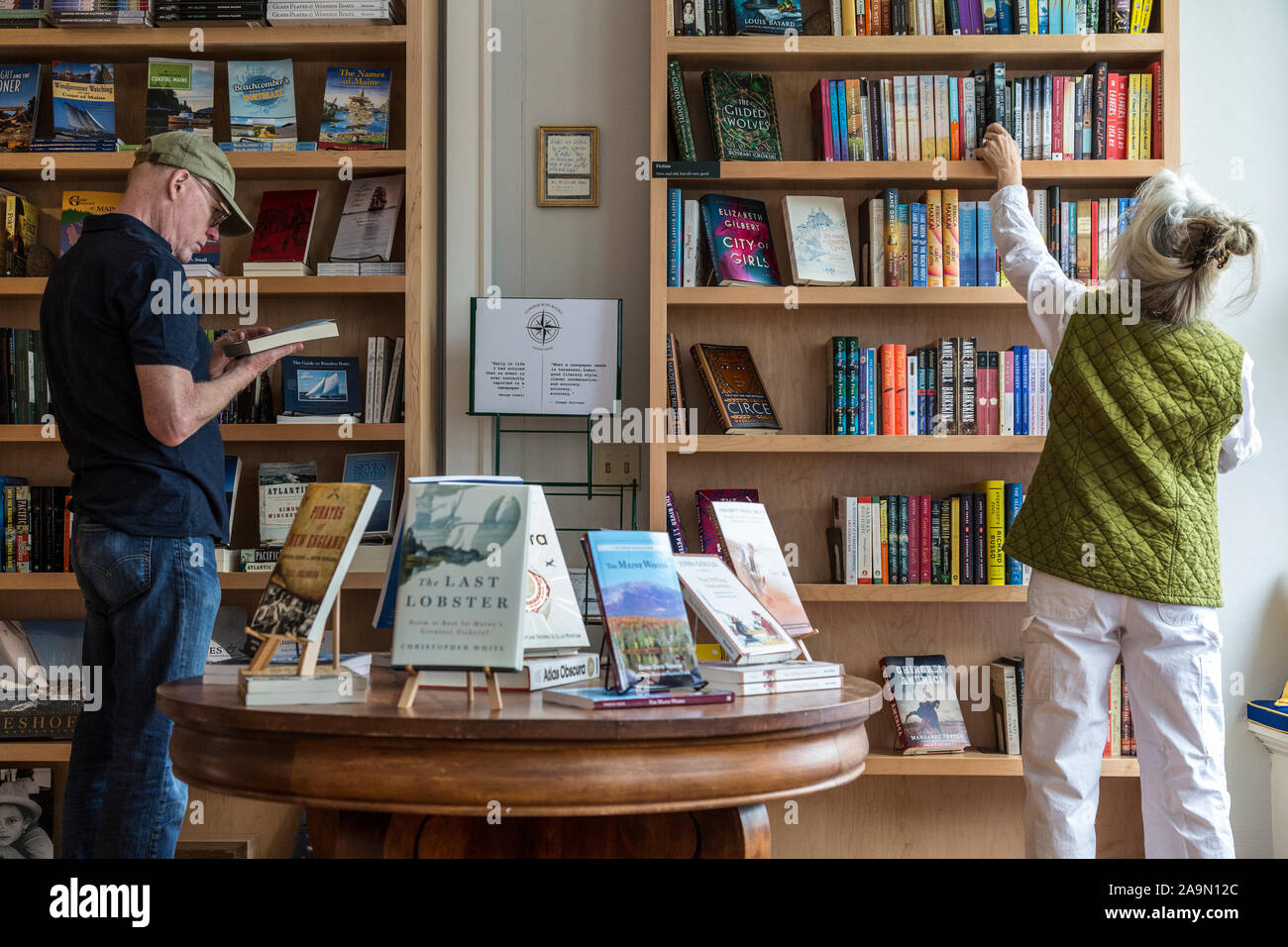 People shopping at independent bookstore in small town, Castine, Maine, New England, USA Stock Photo