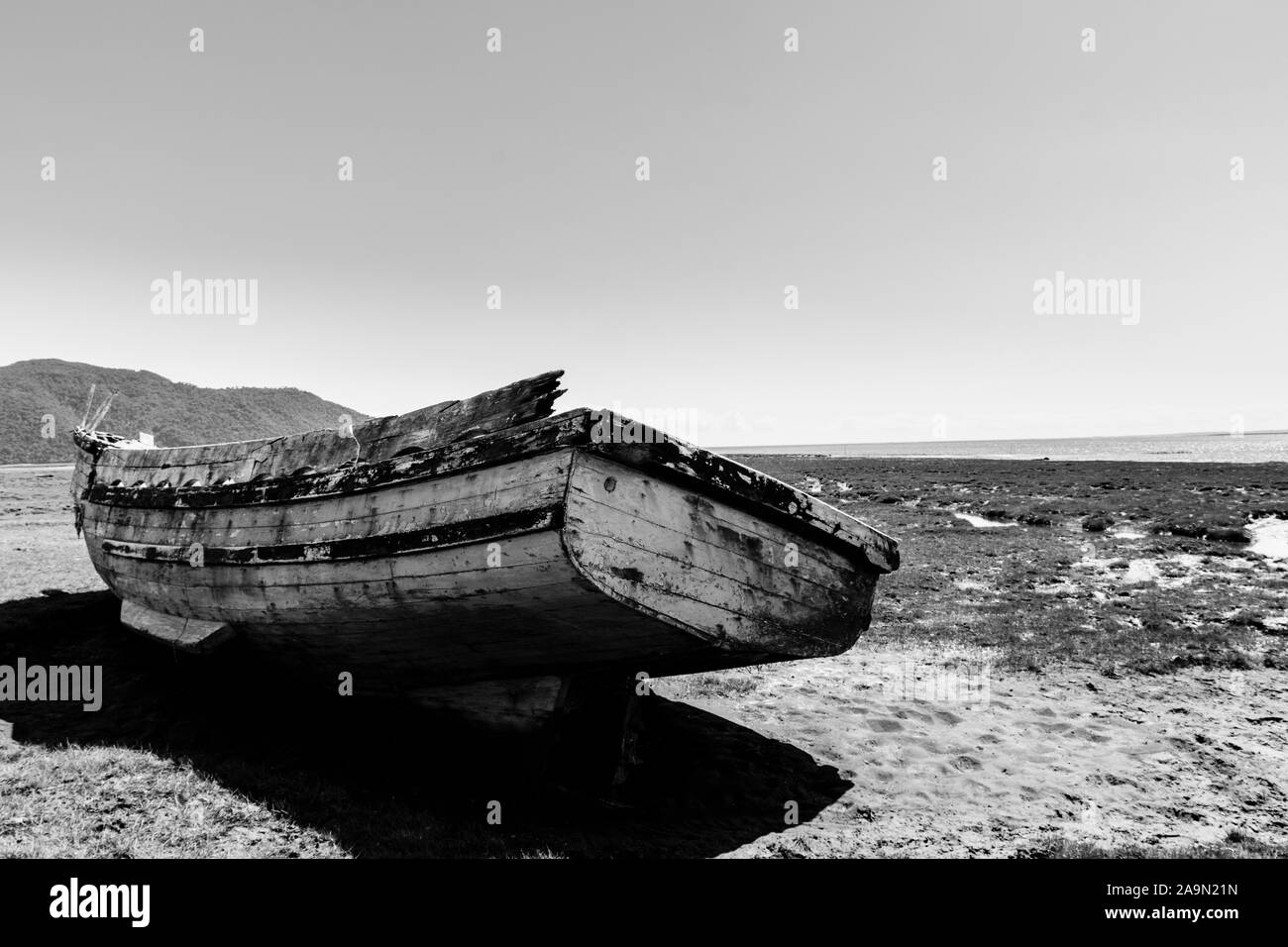 Abandoned, old and rusty fishing boat on the beach in Chaiten, Chile ...