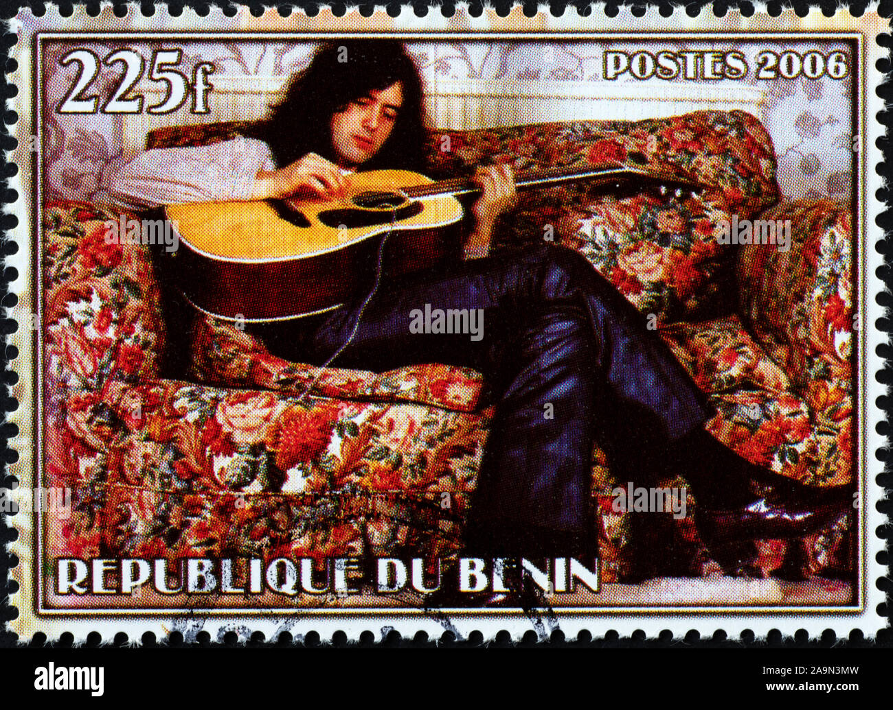 Jimmy Page playing guitar on postage stamp Stock Photo