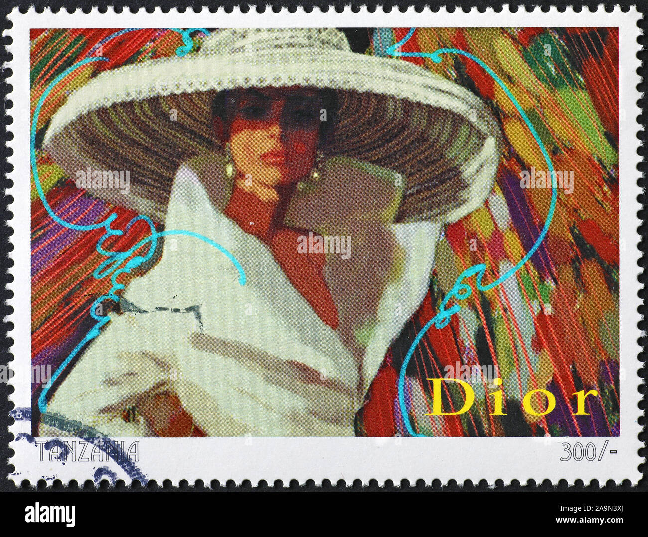 Old advertising of stylist Dior on postage stamp Stock Photo