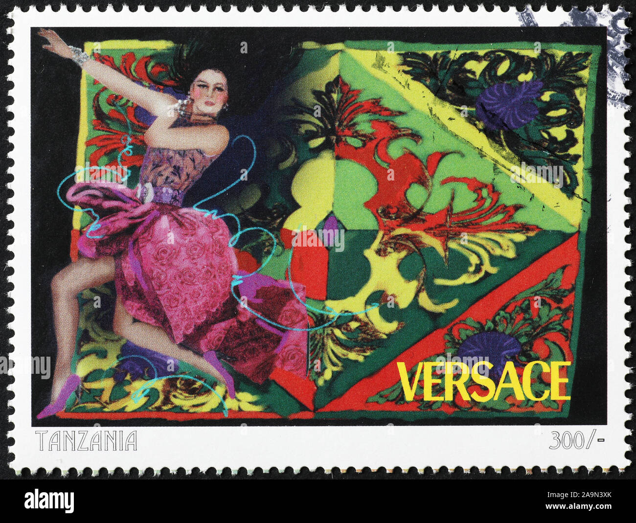 Old advertising of stylist Versace on postage stamp Stock Photo