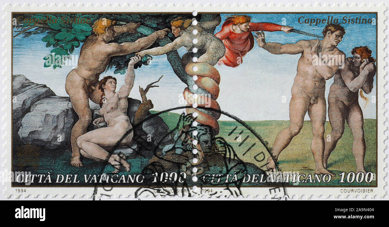 Original sin and expulsion from Eden by Michelangelo on stamp Stock Photo