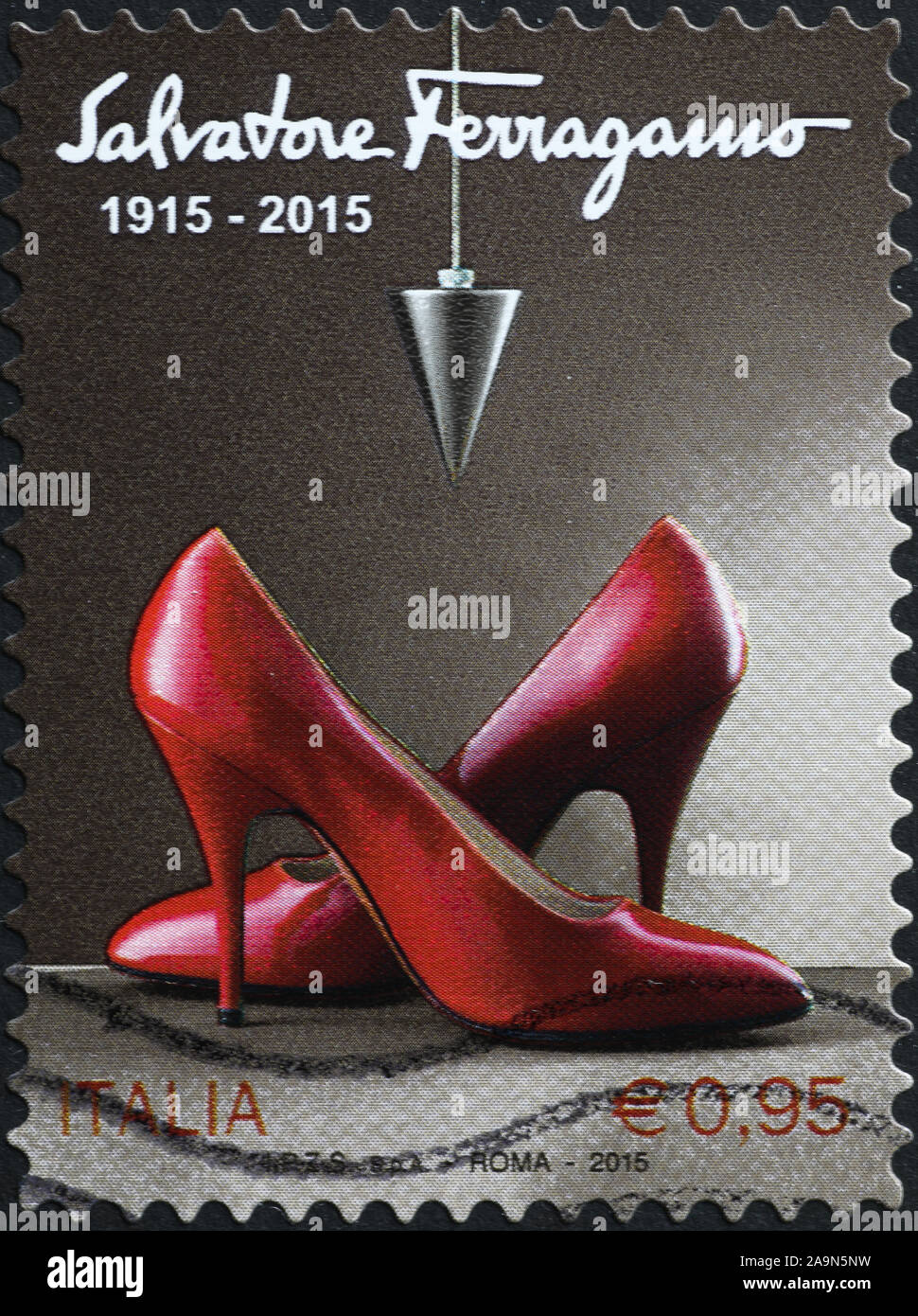 Women's shoes by Salvatore Ferragamo on italian stamp Stock Photo