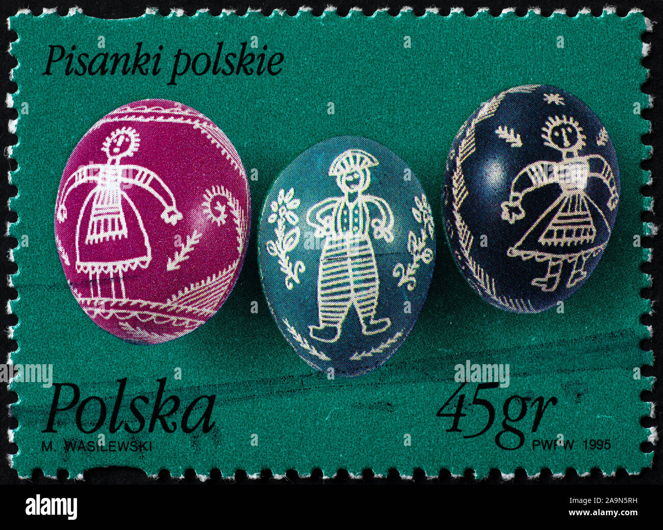 Three painted eggs for Easter on polish postage stamp Stock Photo