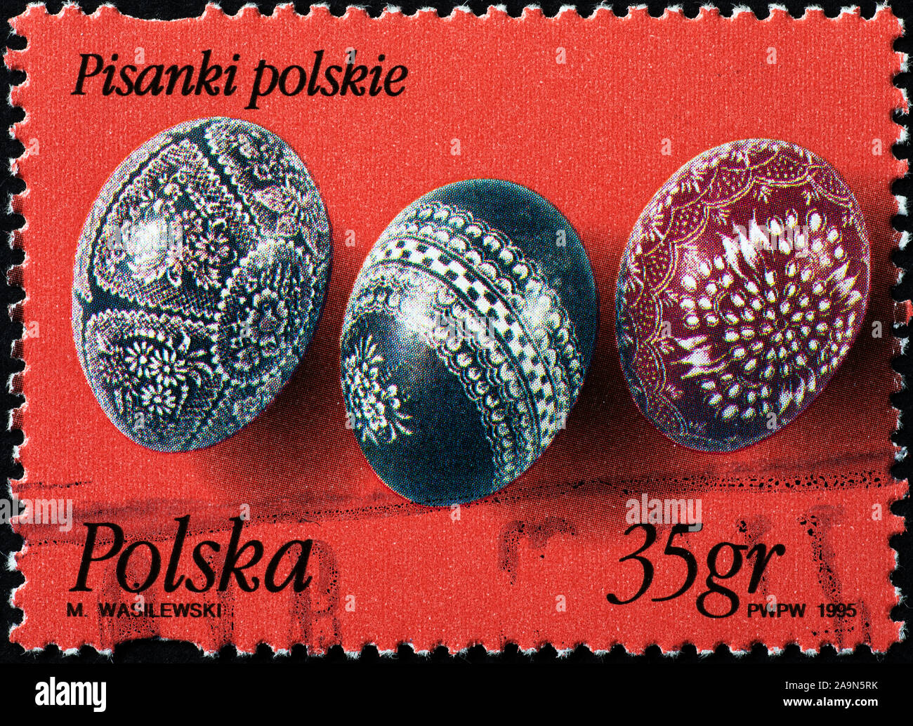 Three painted eggs for Easter on polish stamp Stock Photo