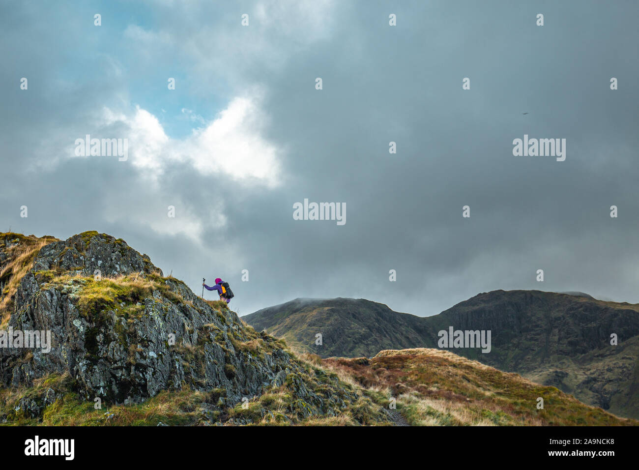 Hiker in the top of Hartsop Above How at autumnal day in Lake District National Park Stock Photo