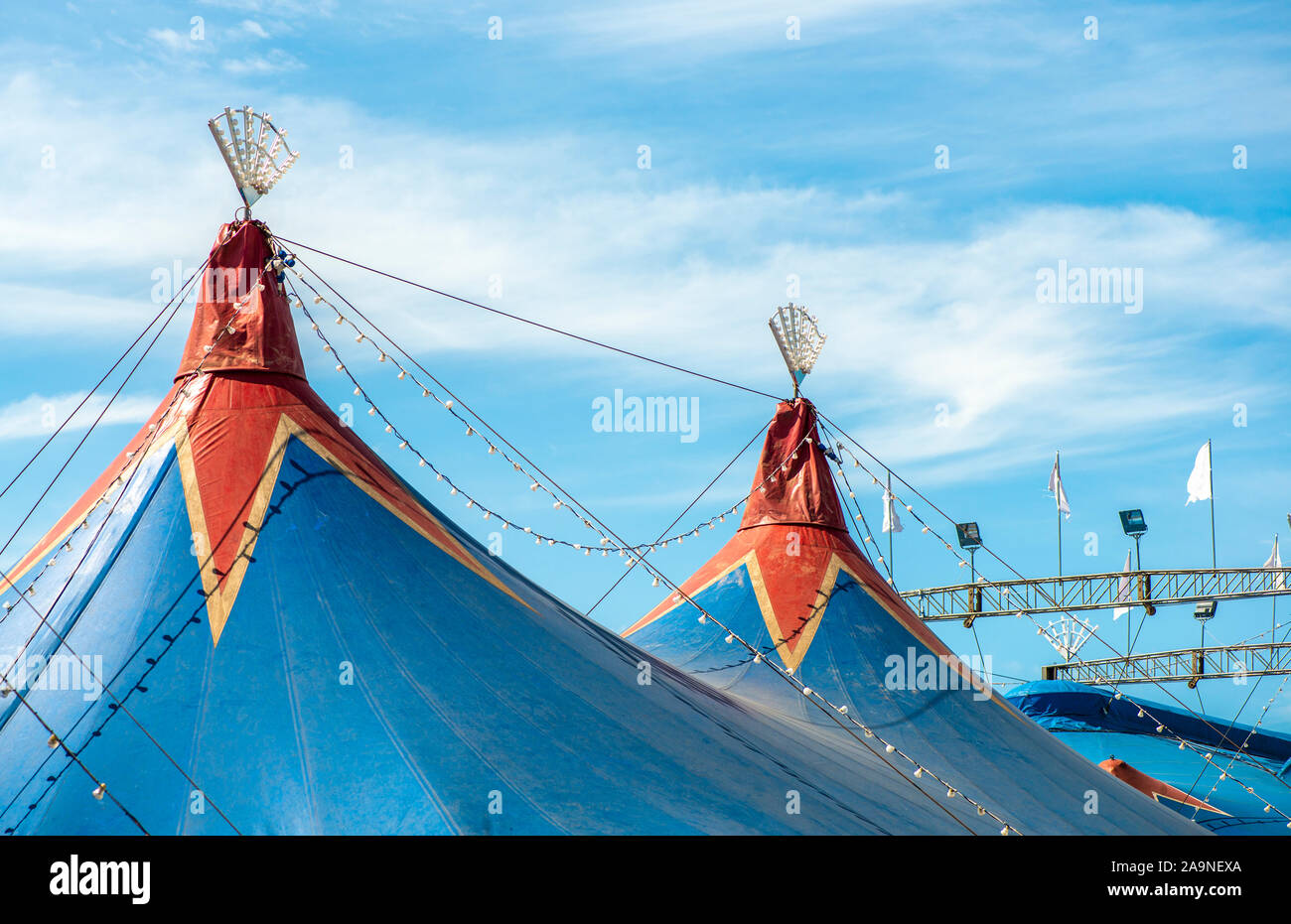 Blue dome of the circus and blue sky. Entertainment concept. Stock Photo