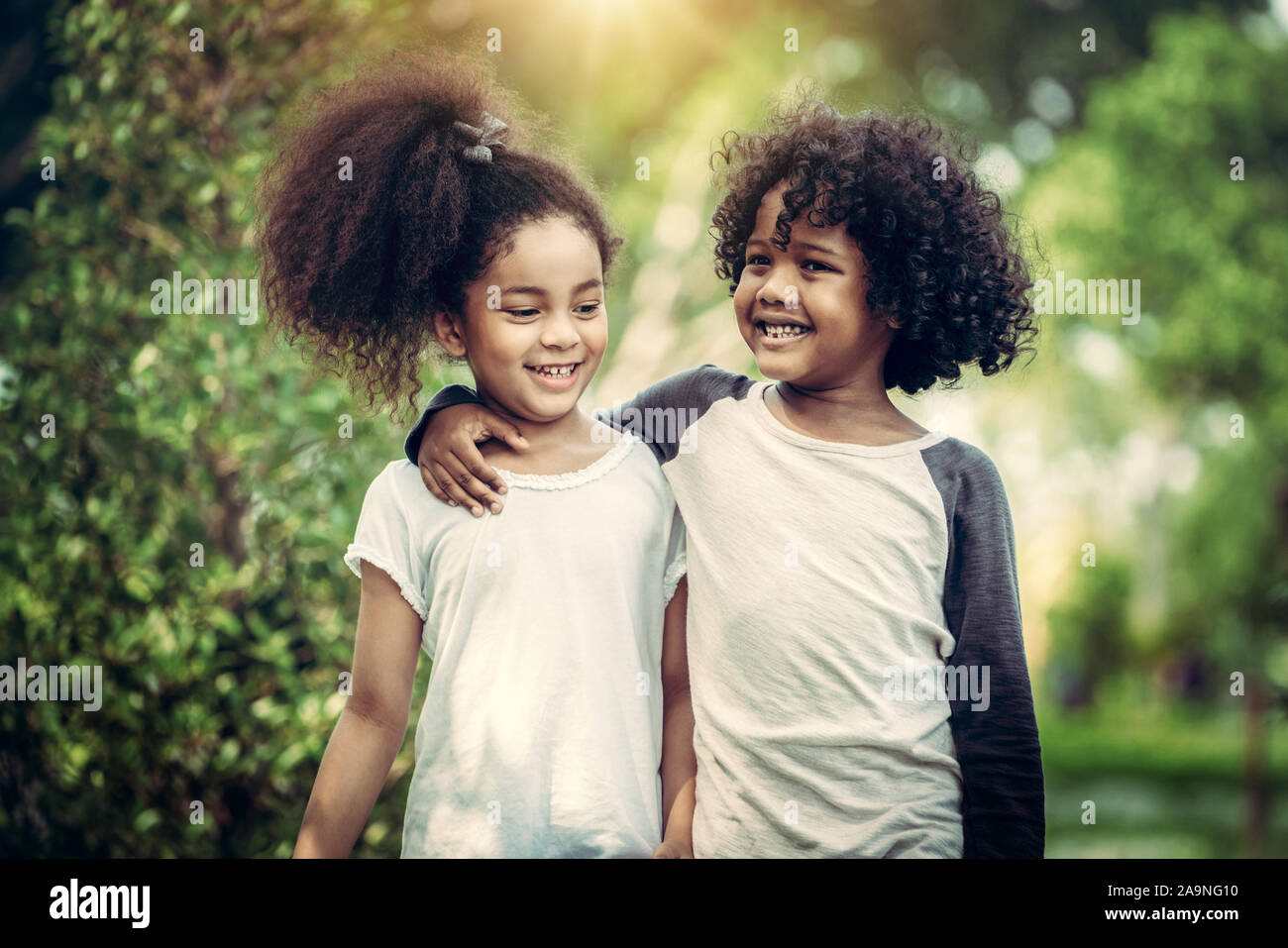 Happy Little Boy And Girl In The Park Two African American
