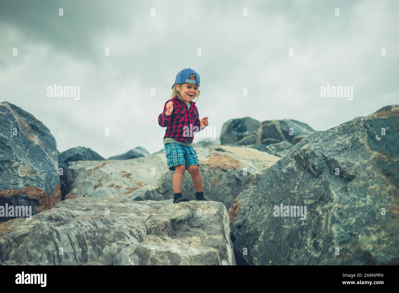 Child Carrying Rocks Child and rocks hi-res stock photography and images - Alamy