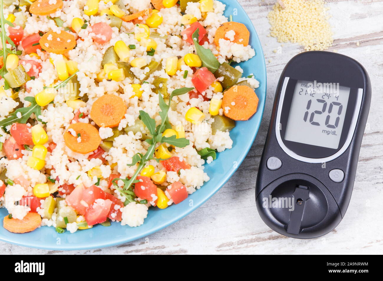 Glucose Meter For Checking Sugar Level And Fresh Salad With Vegetables And Couscous Groats Light And Healthy Meal For Diabetics Containing Vitamins A Stock Photo Alamy