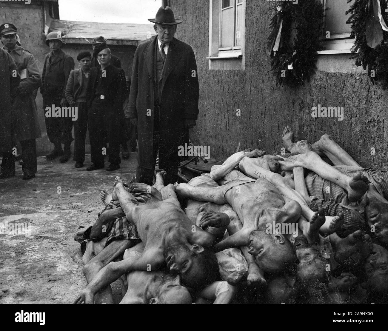 Senator Alben W. Barkley of Kentucky, a member of a congressional committee investigating Nazi atrocities, views the evidence at first hand at Buchenwald concentration camp. Weimar, Germany. 4/24/45. Stock Photo