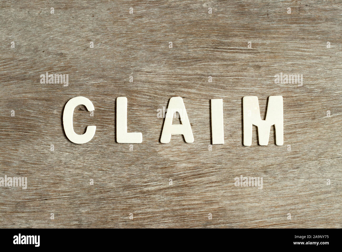 Alphabet letter in word claim on wood background Stock Photo - Alamy