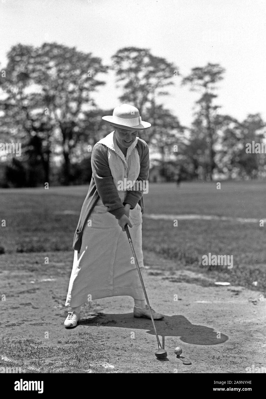 Early 1900s Photos - Woman hitting a golf ball out of a sand trap ...