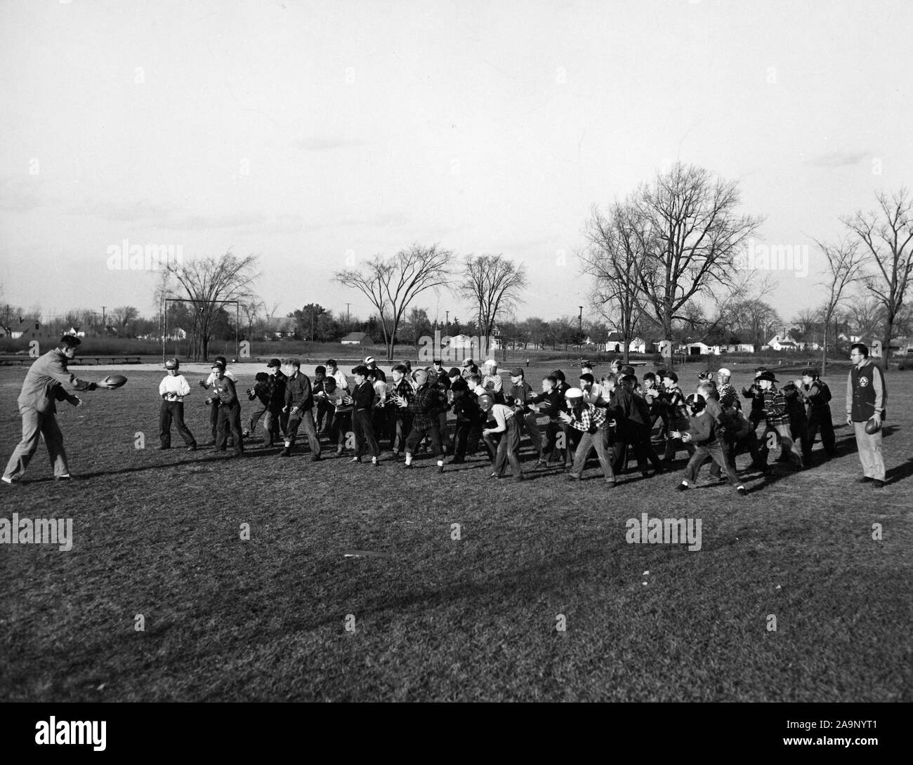 A Group of Boys Receiving Instructions on the Proper Way to Hold a