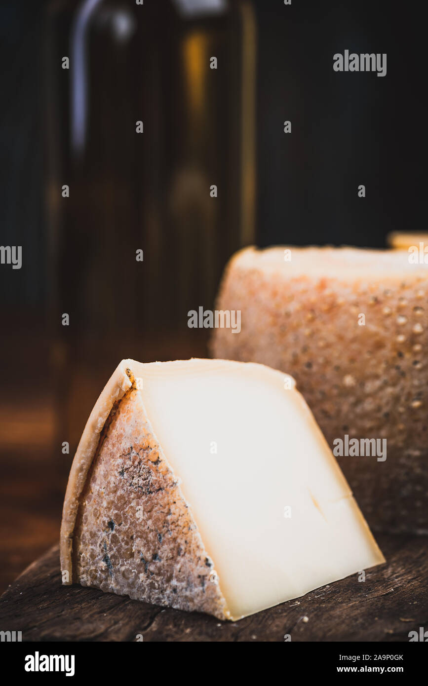 Slice of Hard Matured Cheese from Whole Cheese Wheel Stock Photo Alamy