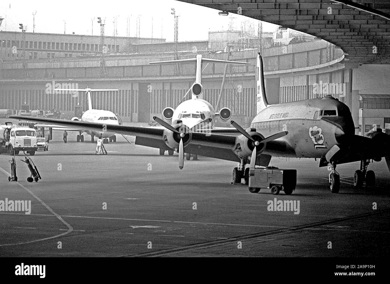Civilian airlines are authorized to land at the Tempelhof Central Airport when bad weather prevents them from landing at the primary airport at Tegel.  The Rosinen Bomber is the first plane from the right. Stock Photo