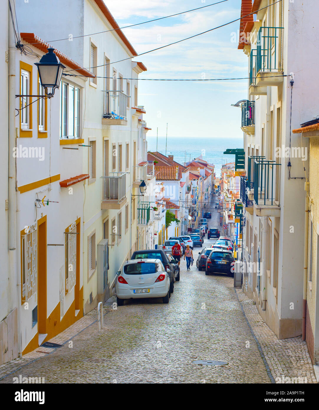 NAZARE, PORTUGAL - OCTOBER 9, 2018: People walking up the street in Nazare. Nazare is the famous tourist destination in Portugal Stock Photo