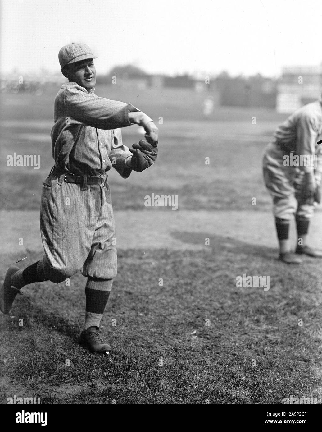 Professional baseball player throwing a ball ca. 19131917 Stock Photo