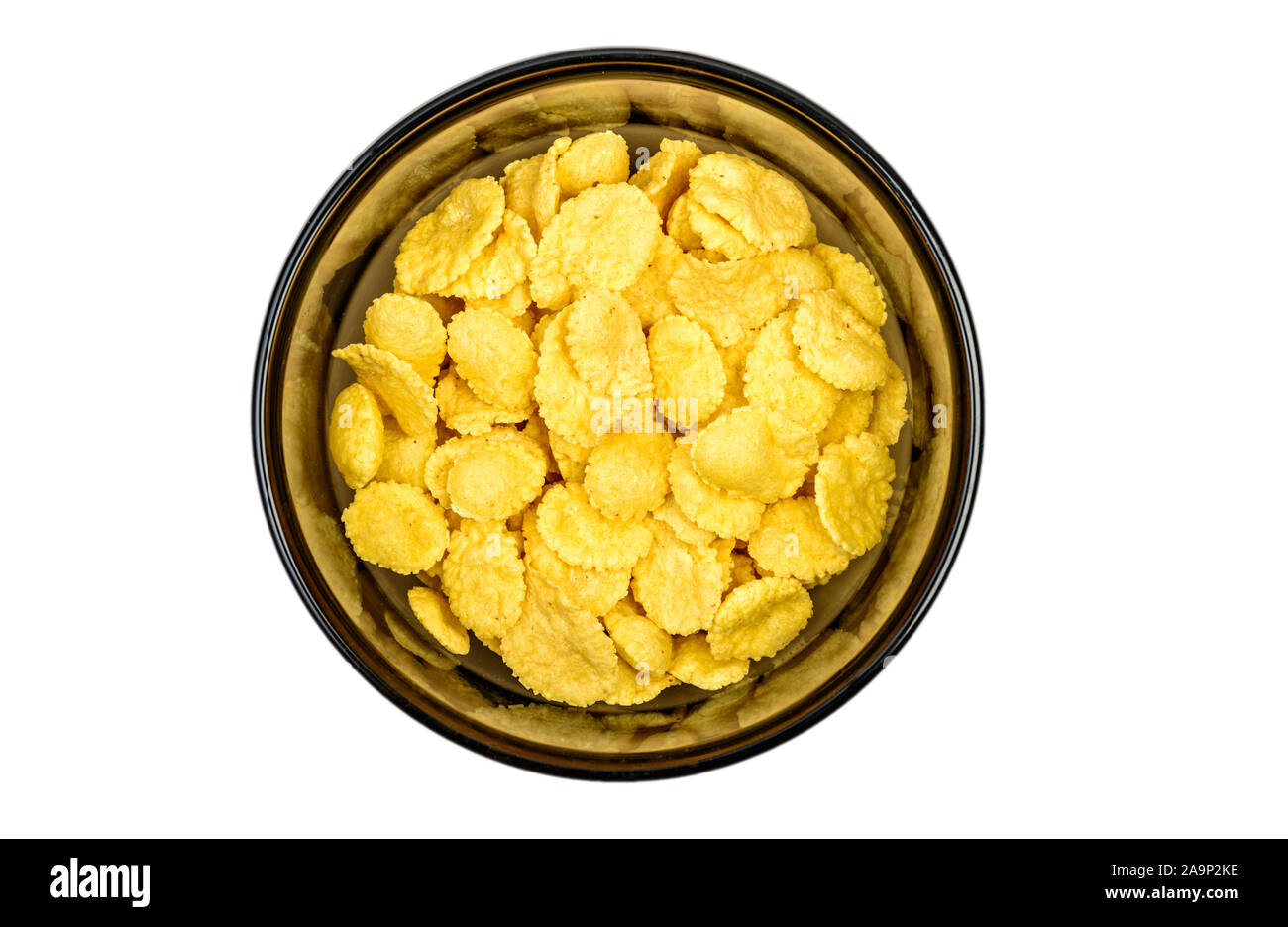 Cornflakes in bowl close up. Corn flakes on white background. Top view Stock Photo - Alamy