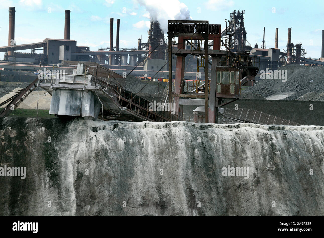 Ore blending and blast furnaces on large integrated steelworks. Stock Photo