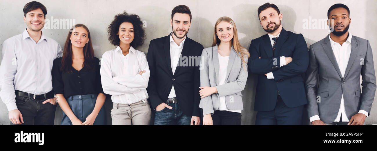 Diverse business team smiling to camera in office Stock Photo - Alamy