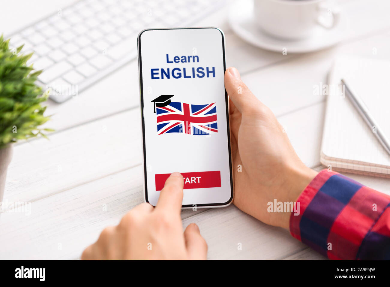 Language Educational App Opened On Smartphone In Man's Hands Stock Photo
