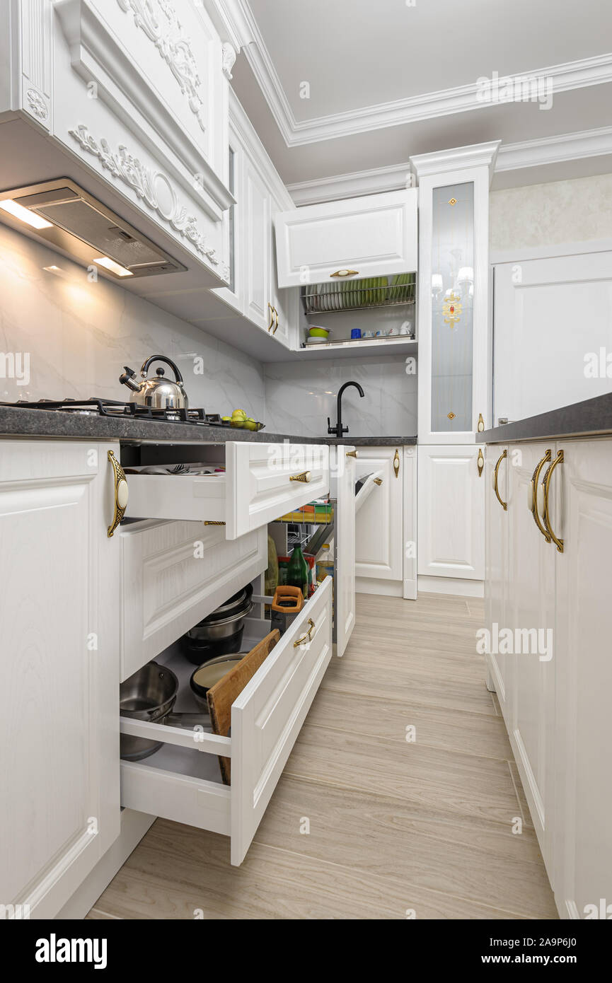 White luxury modern kitchen with island Stock Photo - Alamy