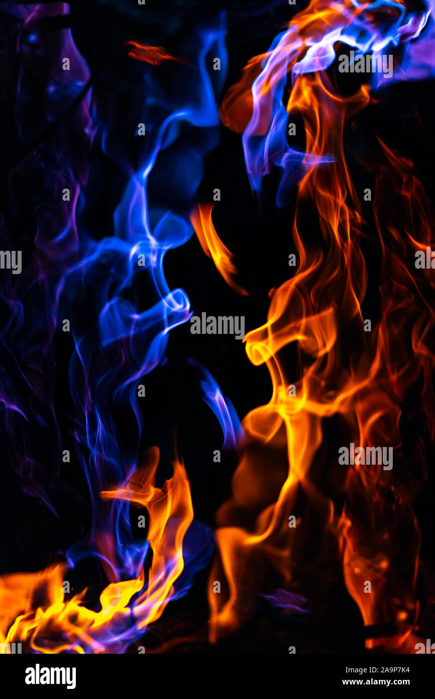 Red and blue fire on balck background Stock Photo - Alamy