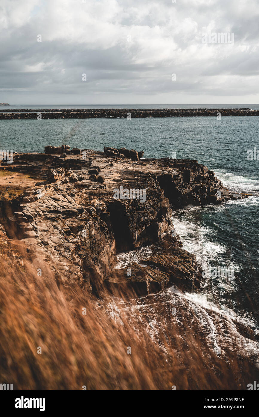 The rocky cliff edge between Turners Beach and Yamba Beach at Clarence