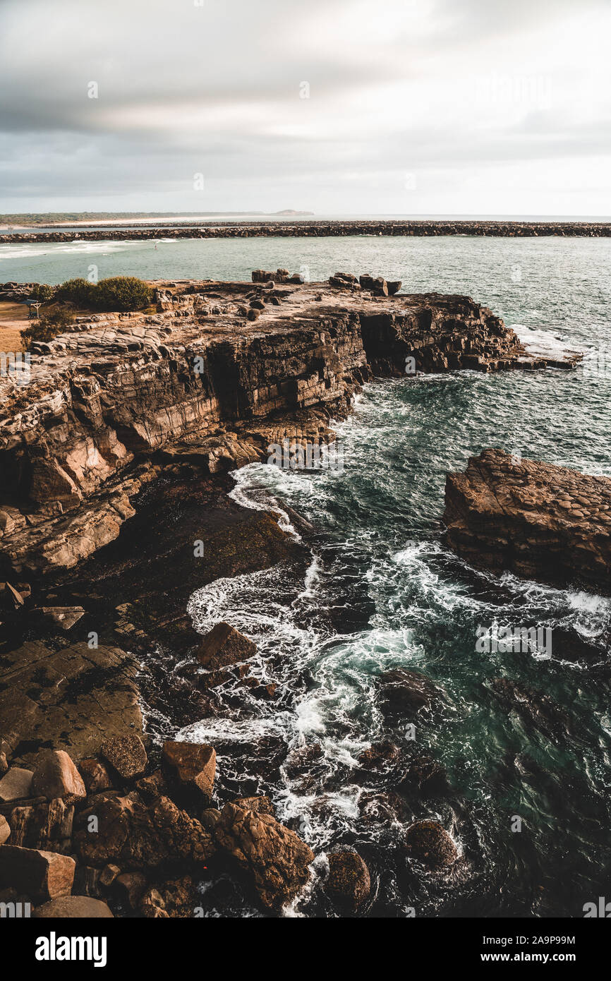 The rocky cliff edge between Turners Beach and Yamba Beach at Clarence