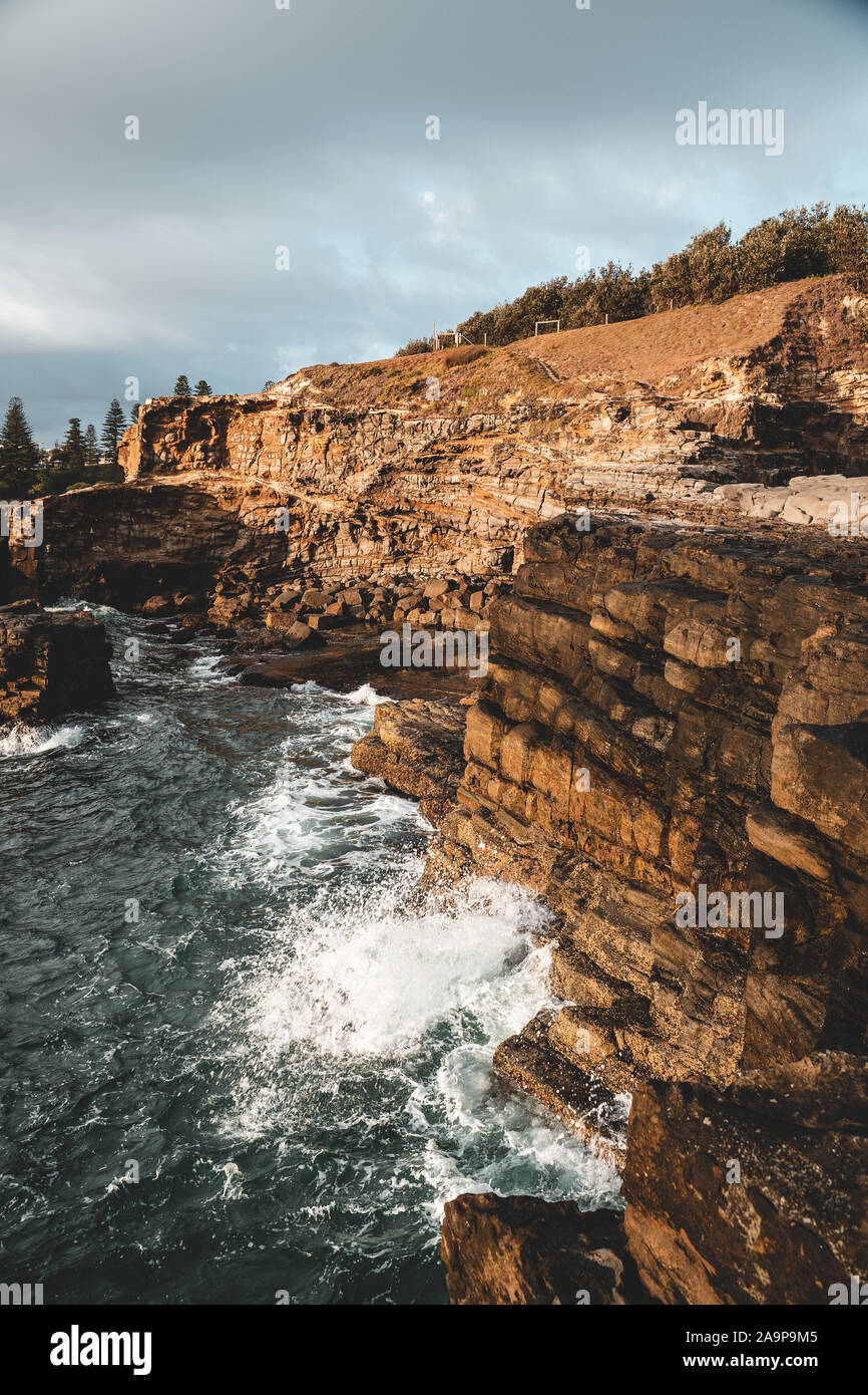 The rocky cliff edge between Turners Beach and Yamba Beach at Clarence