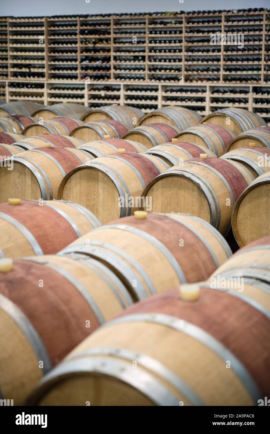 Wooden wine barrels for storage in wine cellar Stock Photo Alamy