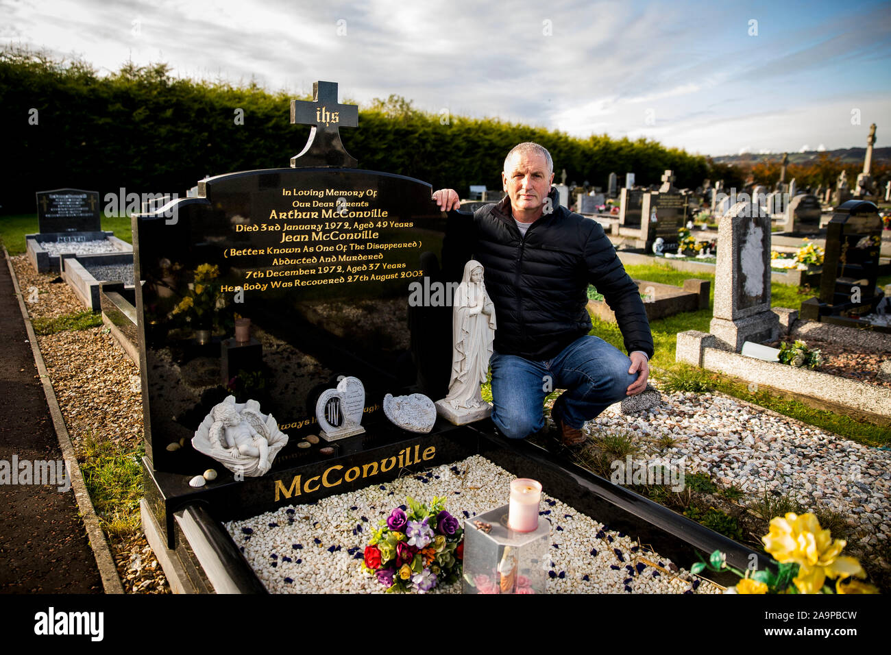 Michael McConville, son of IRA murder victim Jean McConville, at his  parents grave in Lisburn, He has urged the Government to establish a public  inquiry to seek answers Stock Photo - Alamy