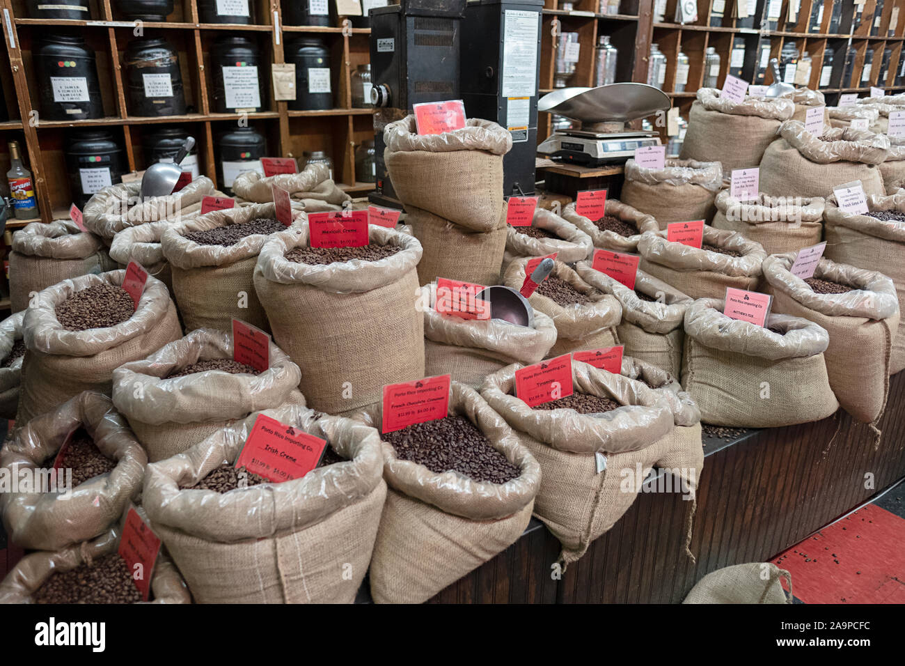 Burlap bags of coffee beans for sale by the pound inside PORTO RICO IMPORTING, a coffee & tea store on Bleeker St. in Greenwich Village, Manhattan. Stock Photo