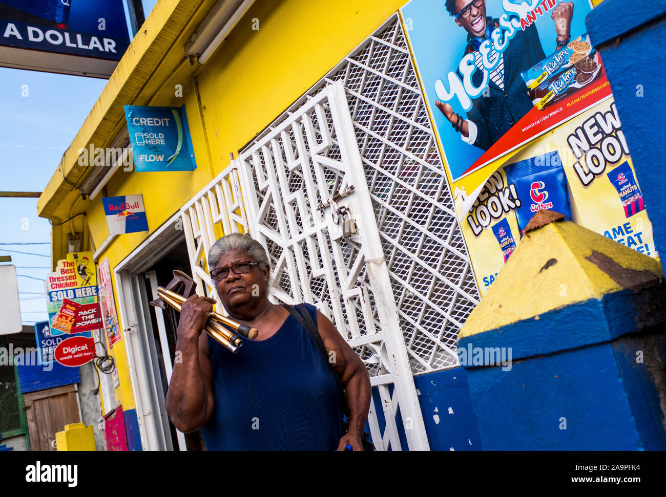 A candid photo of a Jamaican lady outside a shop in runaway /Bay, Jamaica Stock Photo