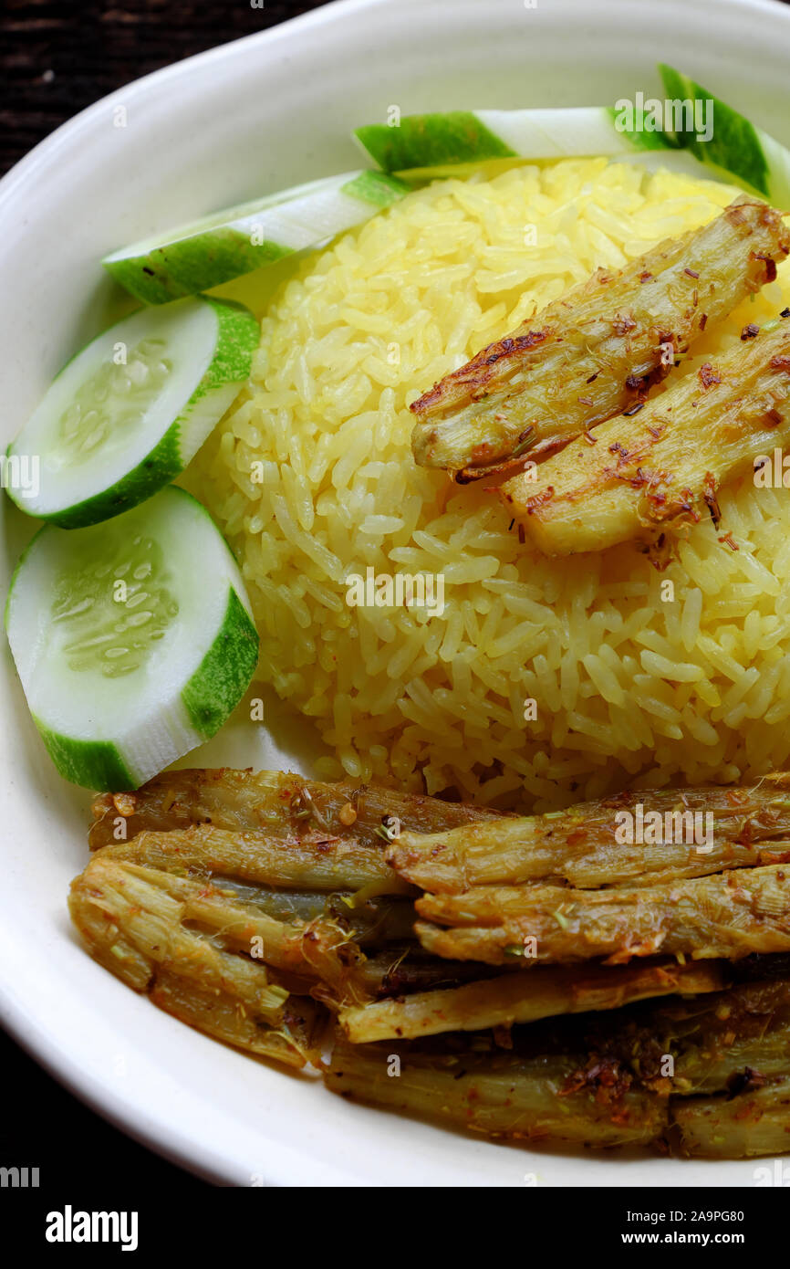 Vietnamese cuisine, vegan dish from vegetables, arrowroot marinated in salt, citronella, deep fried, delicious vegetarian meal rice dish for dinner Stock Photo