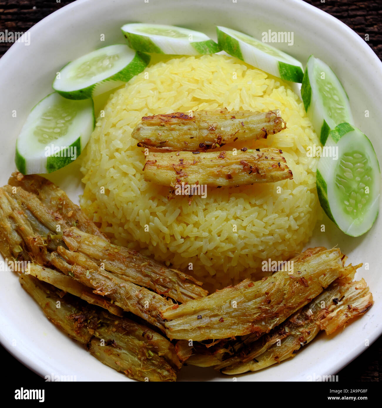 Vietnamese cuisine, vegan dish from vegetables, arrowroot marinated in salt, citronella, deep fried, delicious vegetarian meal rice dish for dinner Stock Photo