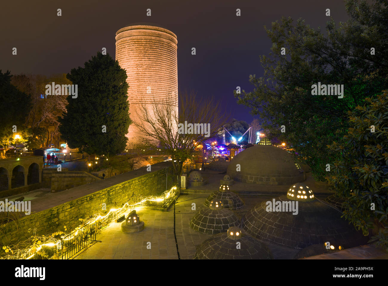 Maiden tower and hamam Haji Gaib in the night scenery of the Old City. Baku, Azerbaijan Stock Photo