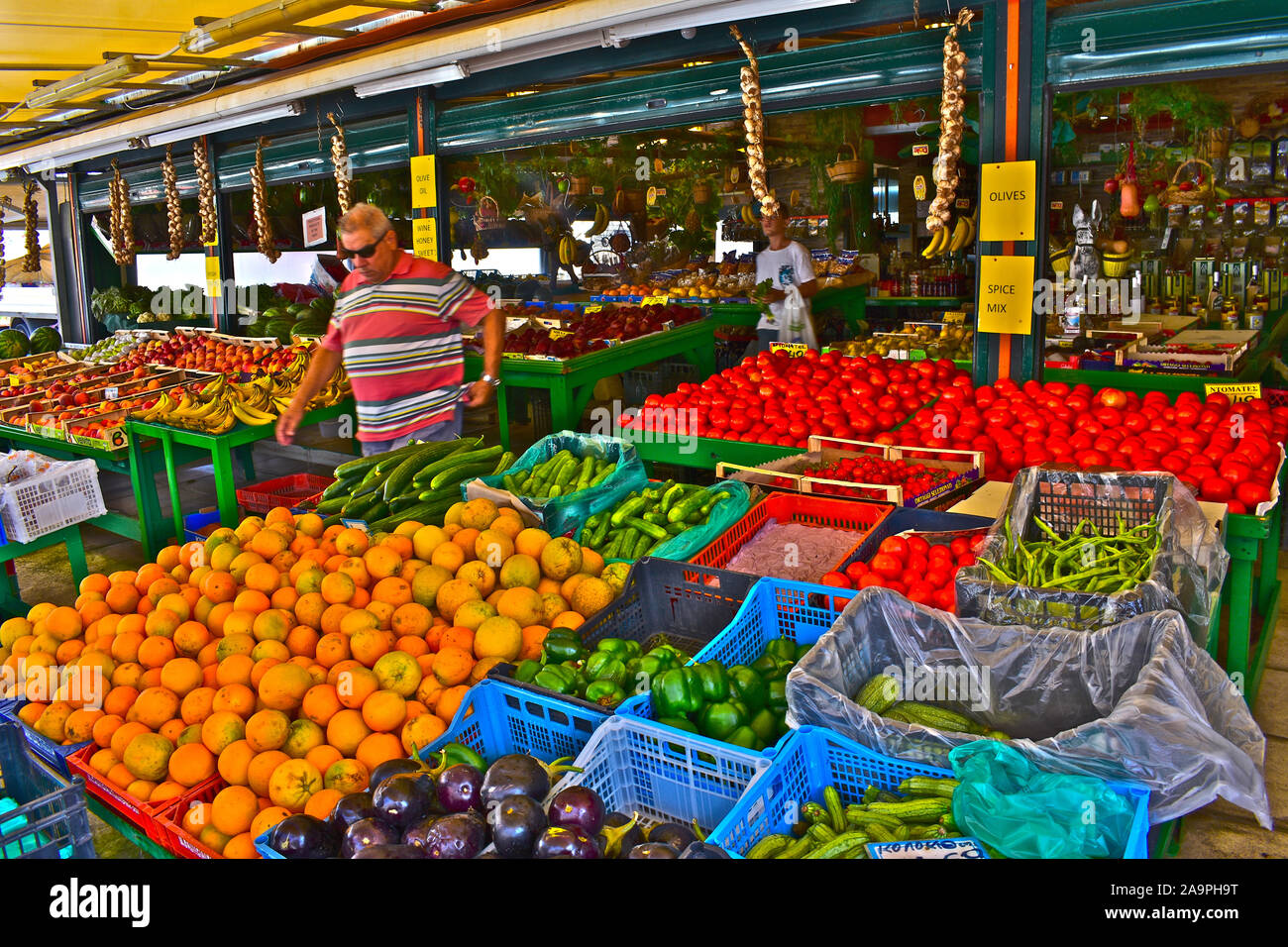 A colourful display of fresh fruit and vegetables in a market stall on ...