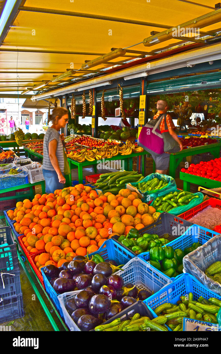 A colourful display of fresh fruit and vegetables in a market stall on ...